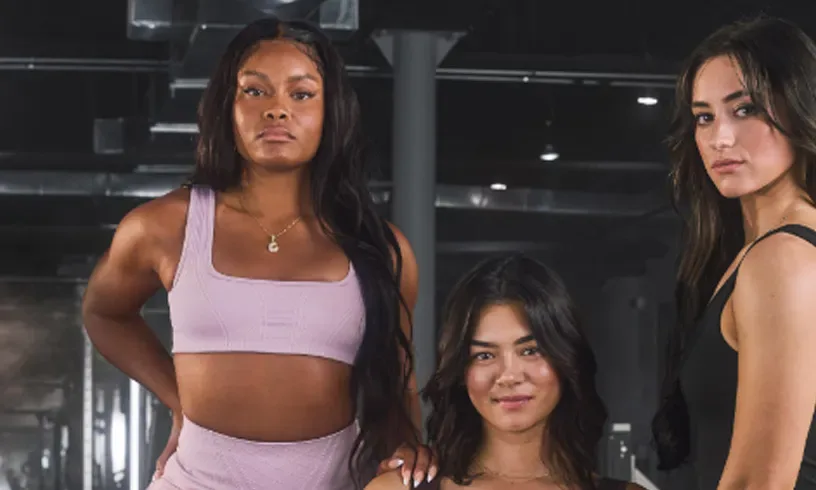 Gymshark brand athletes training in the gym – Purple Perks offer.